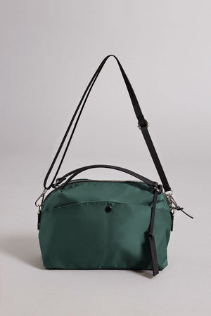 The NYLON CROSSBODY BAG by Velvet by Graham & Spencer is a green rectangular bag with a black adjustable strap, zipper closure, and small front pocket—ideal for everyday use—shown against a plain light background.