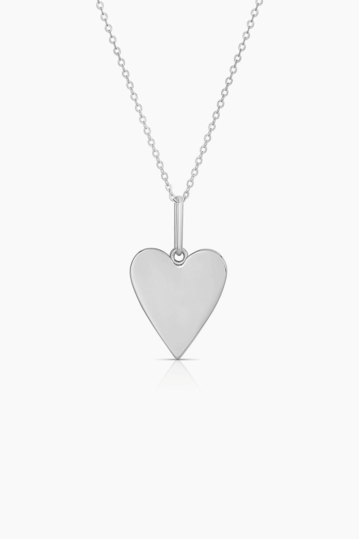 The AMAYA HEART CHARM BY THATCH from Thatch, a delightful silver heart-shaped pendant on a fine chain, is the perfect accessory for any jewelry enthusiast.-38486001156289