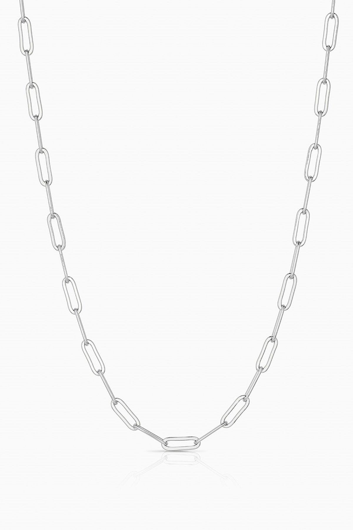 The FINN NECKLACE BY THATCH from Thatch is a handcrafted silver chain necklace with symmetrical, elongated oval links against a white background, highlighting the elegant artistry of a San Diego designer.