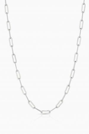 The FINN NECKLACE BY THATCH from Thatch is a handcrafted silver chain necklace with symmetrical, elongated oval links against a white background, highlighting the elegant artistry of a San Diego designer.
