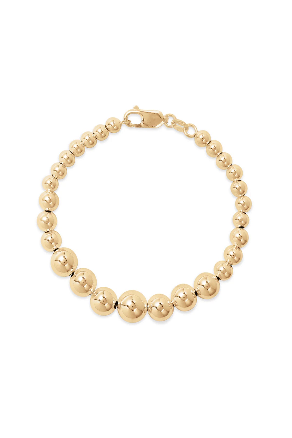 The Graduate Bracelet by Phyllis+Rosie, featuring a gold beaded design and lobster clasp closure, effortlessly chic and reminiscent of vintage street culture.