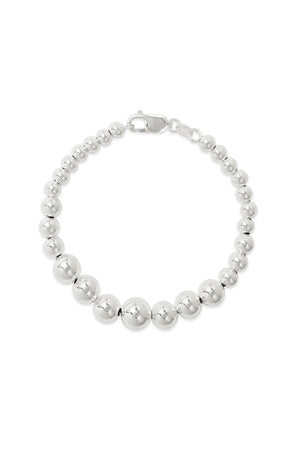 THE GRADUATE BRACELET BY PHYLLIS AND ROSIE by Phyllis+Rosie is a silver bead bracelet featuring uniformly sized spherical beads, a lobster clasp closure, and an effortlessly chic vibe.