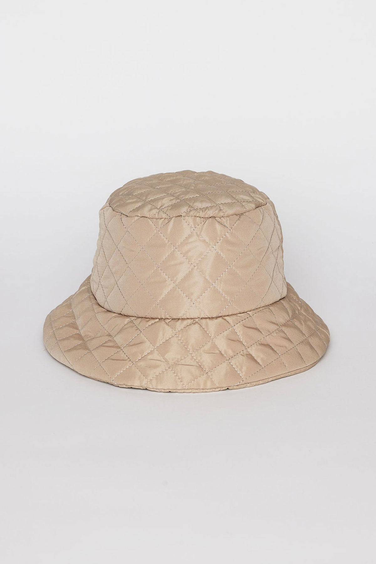 Beige MODERN QUILTED BUCKET HAT by Velvet by Graham & Spencer featuring a diamond pattern on a plain white background.-38485968289985