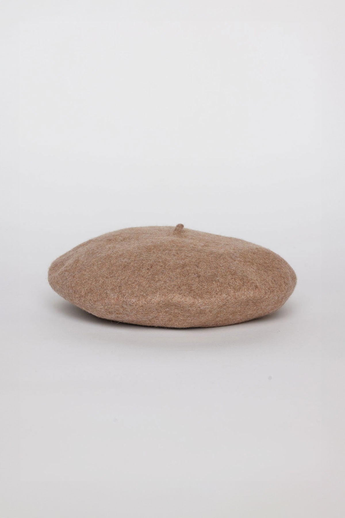 A CLASSIC BERET from Velvet by Graham & Spencer is lying flat against a white background.-37816925028545