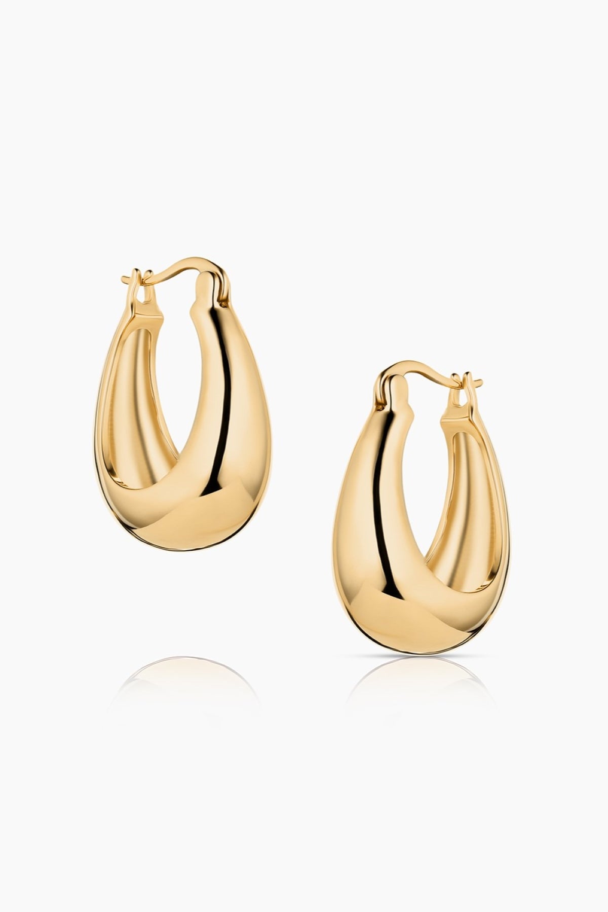 Two PETITE LUMI HOOP EARRINGS BY THATCH in gold polish are showcased on a white background.