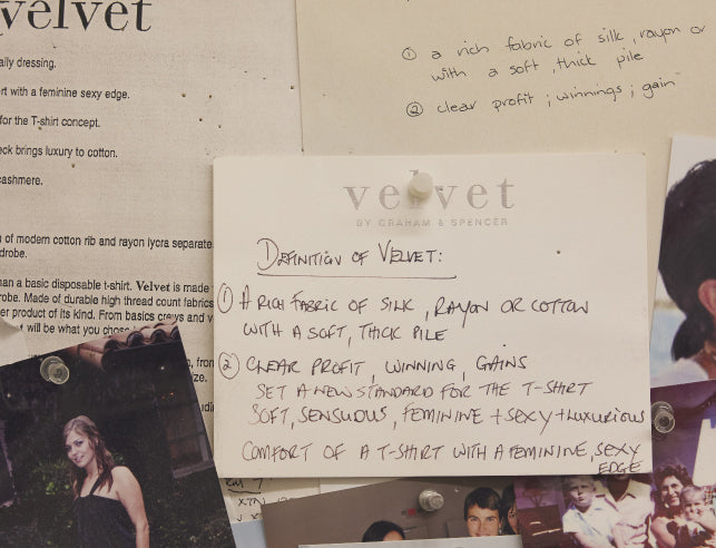 An assortment of pinned notes and articles discussing the definition, qualities, and comparison of silk and cotton fabrics on a bulletin board.