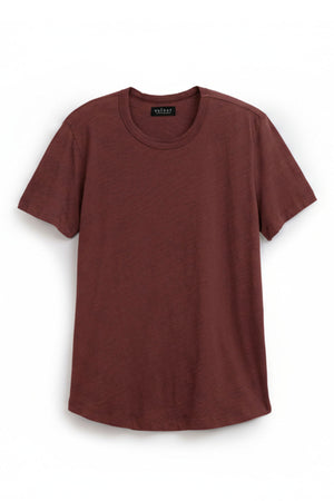 The AMARO TEE by Velvet by Graham & Spencer is a solid brown, short-sleeved crewneck made from soft Peruvian cotton—ideal for layering or wearing solo against a white background.
