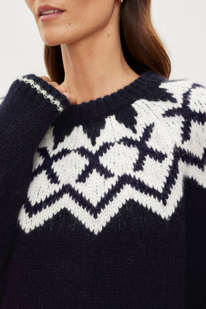 A woman wearing the Velvet by Graham & Spencer ALEXA FAIR ISLE CREW NECK SWEATER.