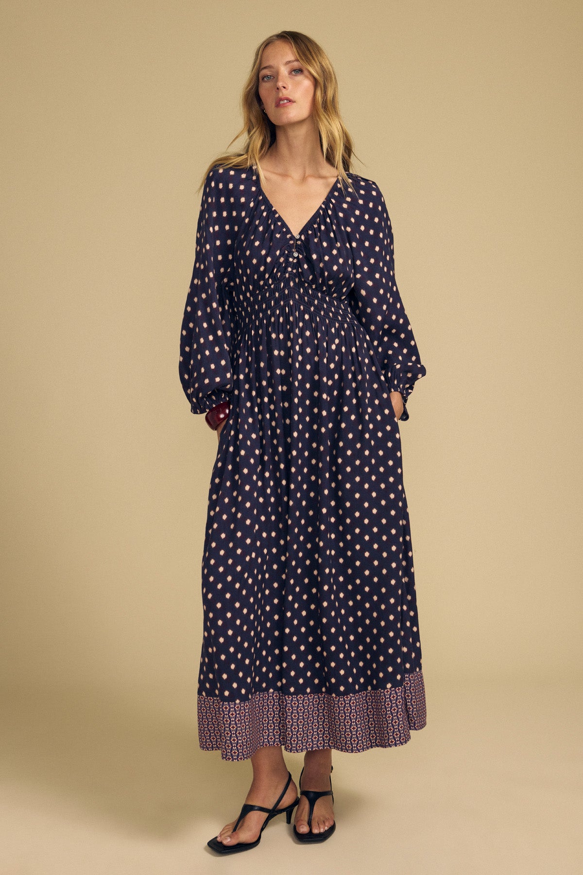Velvet by Graham & Spencer MALLORY PRINTED DRESS: a navy blue midi dress featuring a light diamond print, V-neckline, smocked waist, and border print hem.-46489565888705