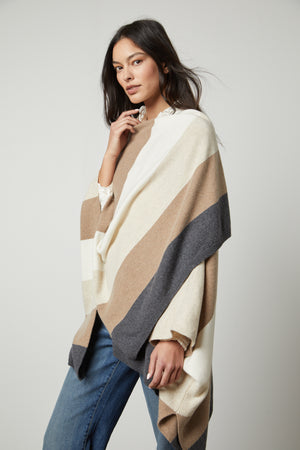 A model wearing a Velvet by Graham & Spencer Jonas Striped Open Front Poncho.