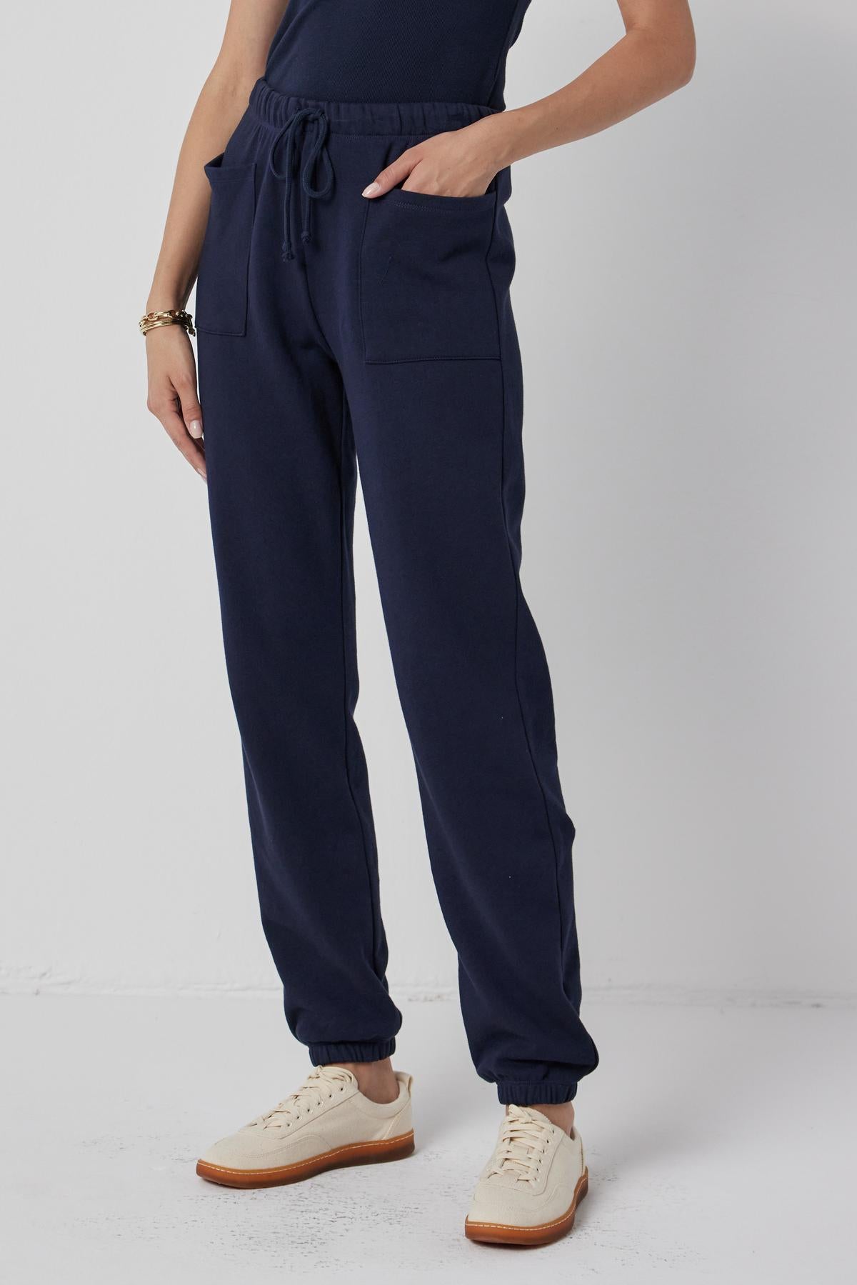 The model is wearing a Velvet by Jenny Graham WESTLAKE SWEATPANT with pockets.-36168729723073