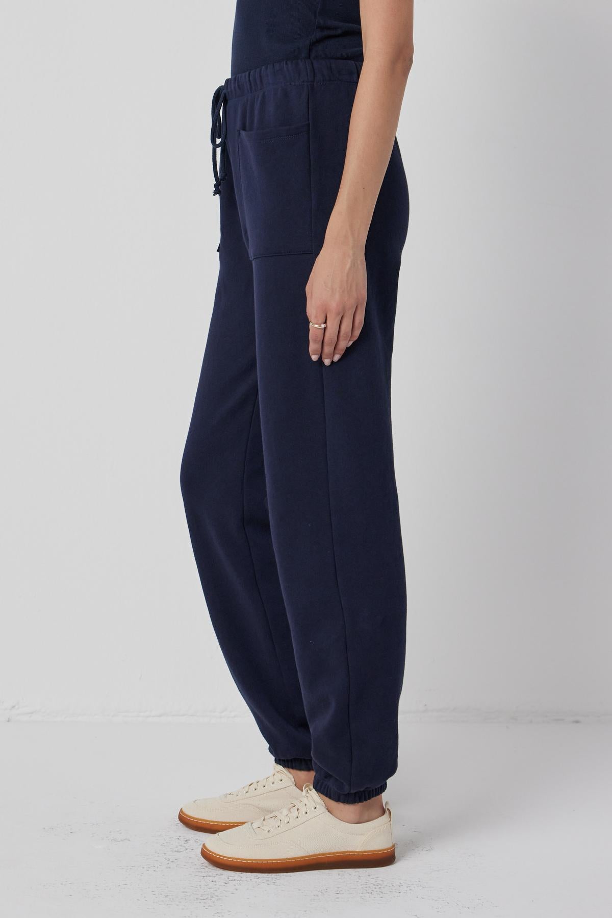 A woman wearing Velvet by Jenny Graham WESTLAKE SWEATPANT and a white t - shirt.-36168729755841
