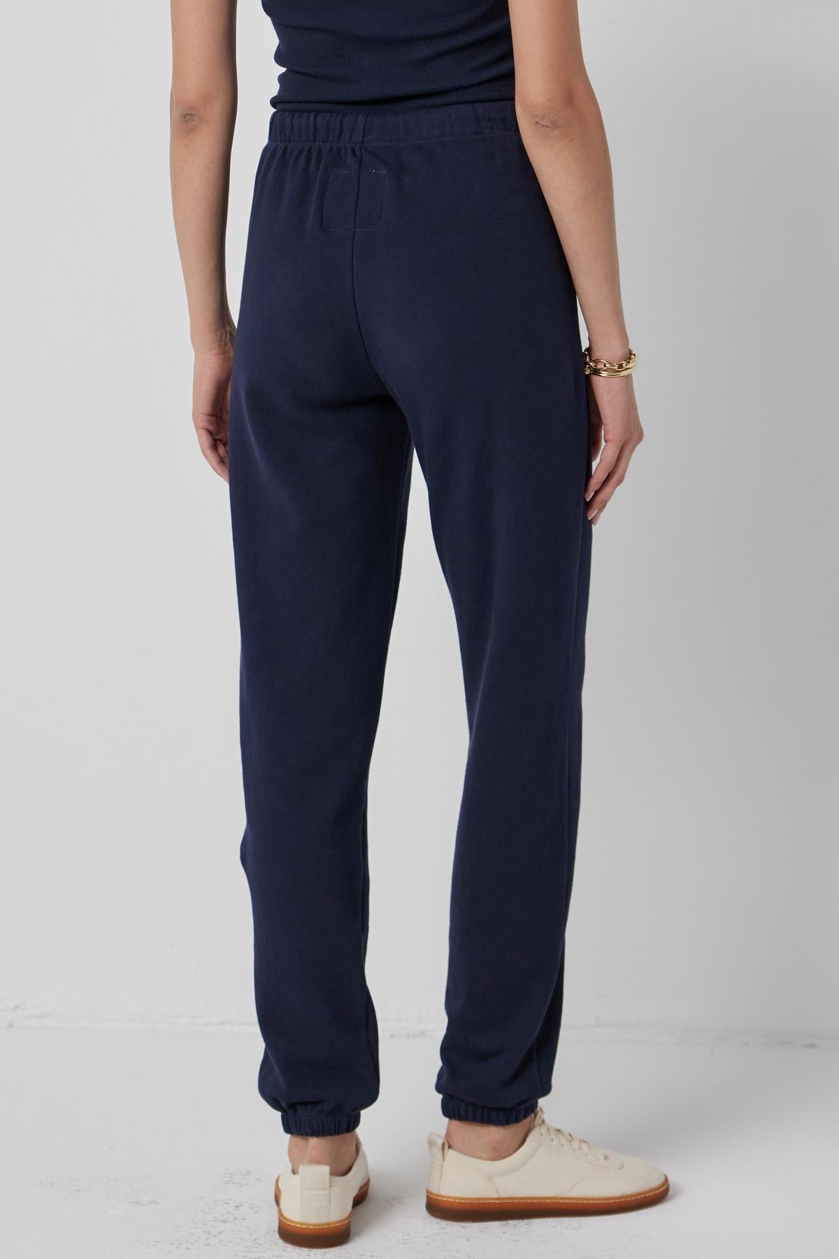 The back view of a woman wearing Velvet by Jenny Graham's WESTLAKE SWEATPANT.-36168729788609
