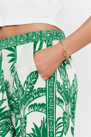 Close-up of a person's hand partially tucked into the pocket of a Velvet by Graham & Spencer IRIS PANT.