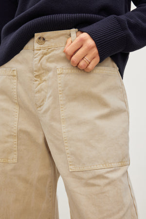 A woman wearing Velvet by Graham & Spencer's BRYLIE SANDED TWILL UTILITY PANT.