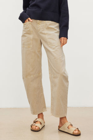 The model is wearing beige BRYLIE SANDED TWILL UTILITY PANT made by Velvet by Graham & Spencer.