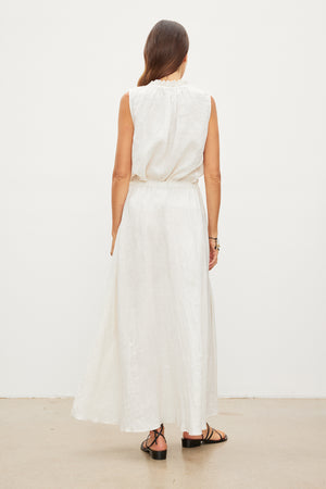 The back view of a woman wearing a Velvet by Graham & Spencer MASIE LINEN TANK TOP.