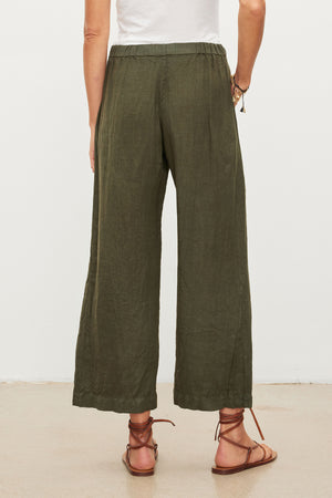 The back view of a woman wearing Velvet by Graham & Spencer LOLA LINEN PANT.