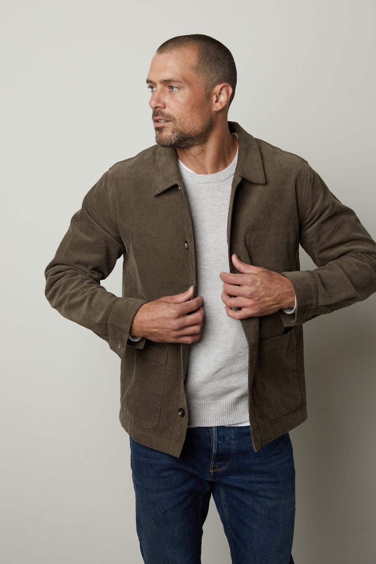 The man is wearing a Velvet by Graham & Spencer REIKO CORDUROY CHORE JACKET.-26846359322817