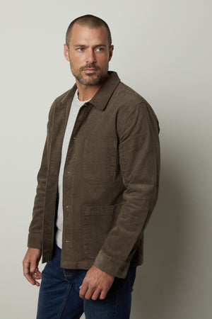 A man sporting a REIKO corduroy chore jacket by Velvet by Graham & Spencer for practicality and style.