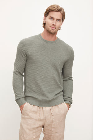 The model is wearing a Velvet by Graham & Spencer ACE THERMAL CREW.