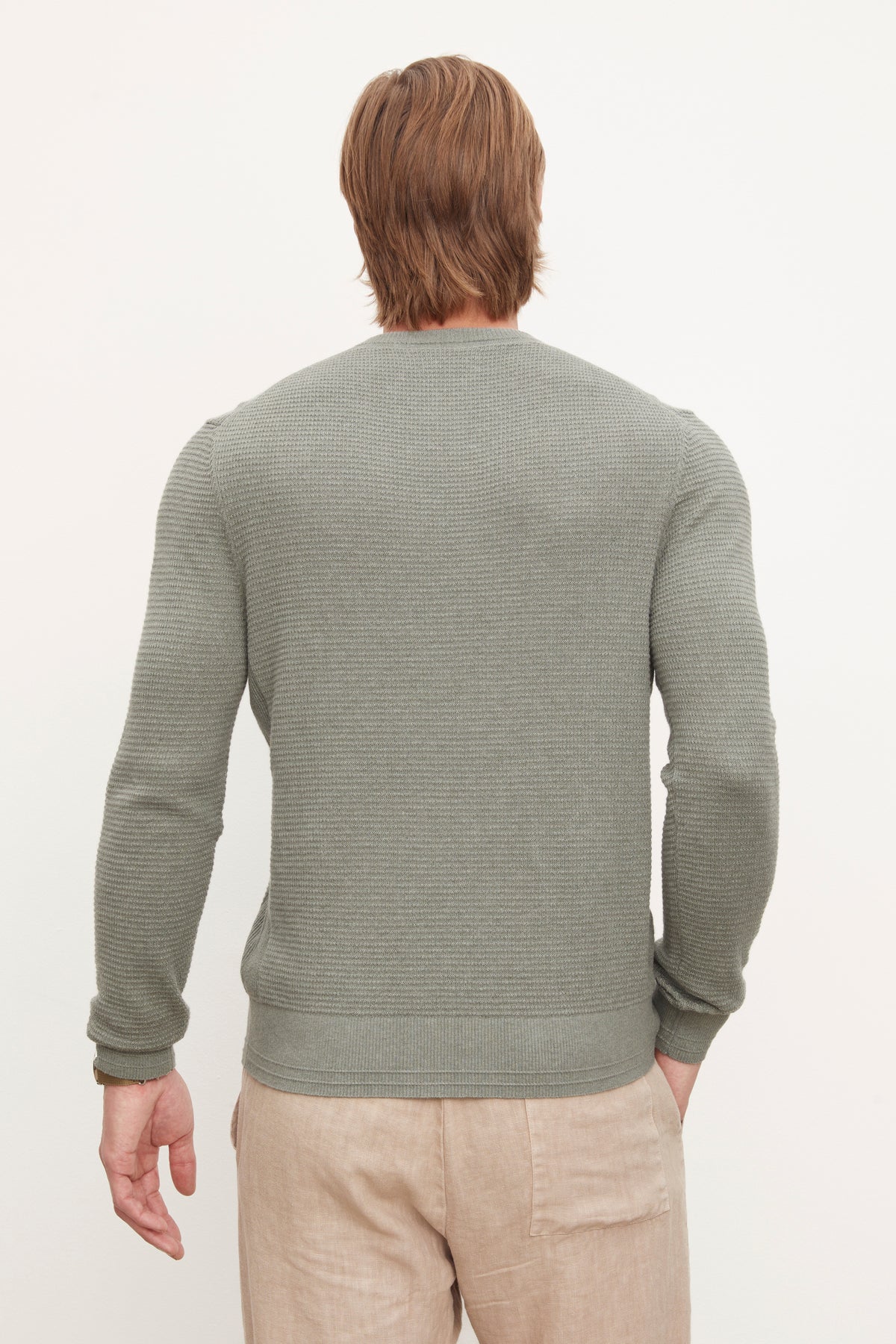 The back view of a man wearing a long-sleeve grey Velvet by Graham & Spencer ACE THERMAL CREW made of cotton with cashmere.