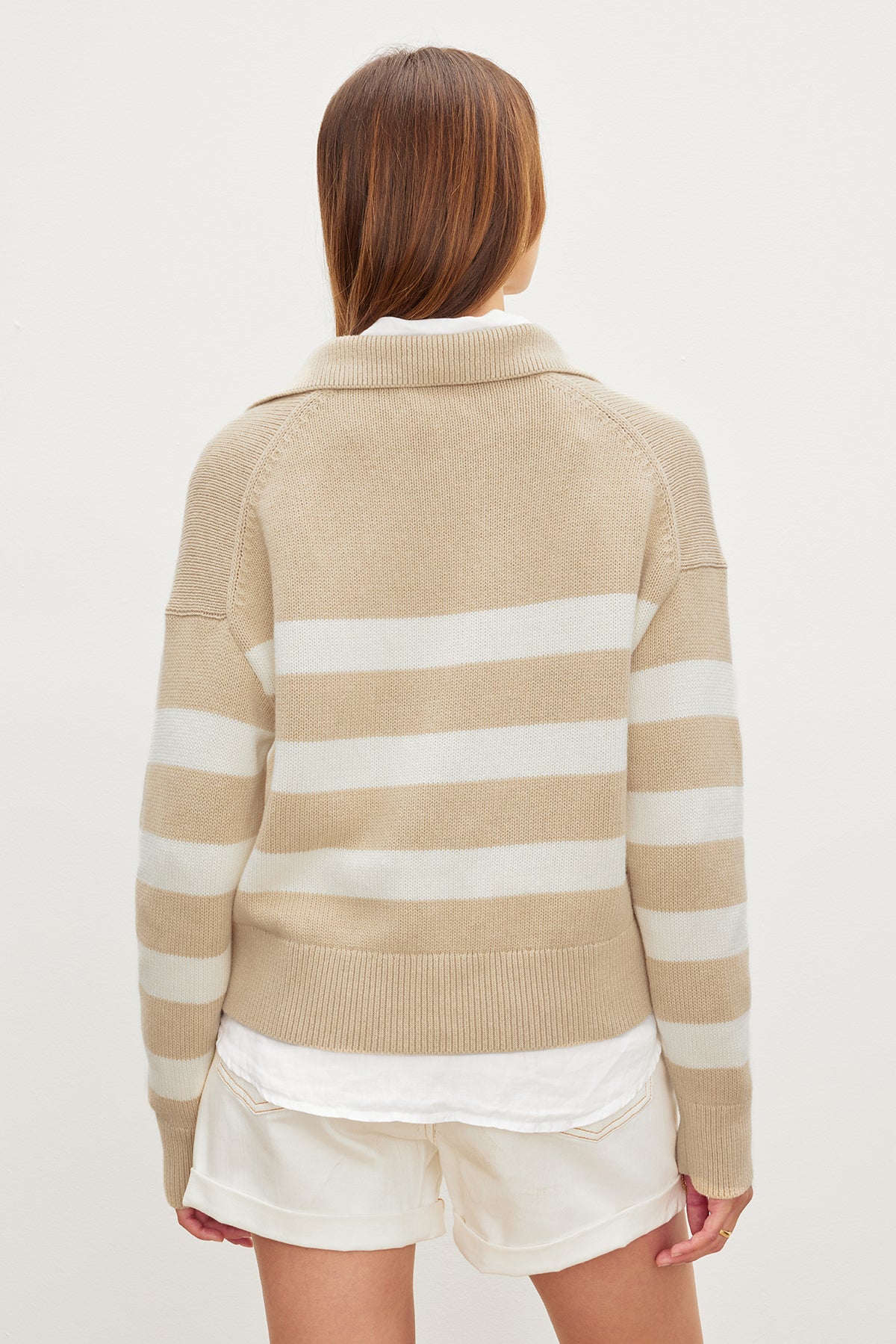 A woman wearing a Velvet by Graham & Spencer LUCIE POLO SWEATER made of cotton/cashmere.-35967604555969