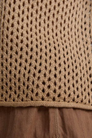 Close-up of a beige mesh knit layered over the brown Velvet by Graham & Spencer POPPY Cotton Cashmere Mesh Sweater.