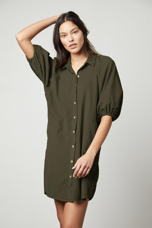 A model wearing a Velvet by Graham & Spencer KADY CORDUROY BUTTON-UP DRESS.