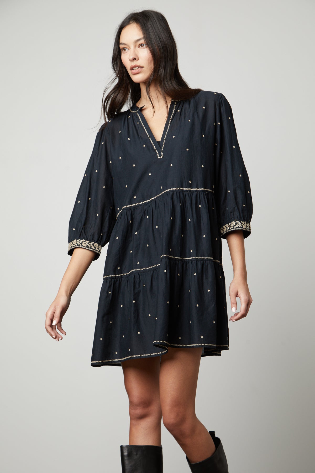 A woman wearing the Velvet by Graham & Spencer KILEY EMBROIDERED BOHO DRESS and black boots.-26727746535617