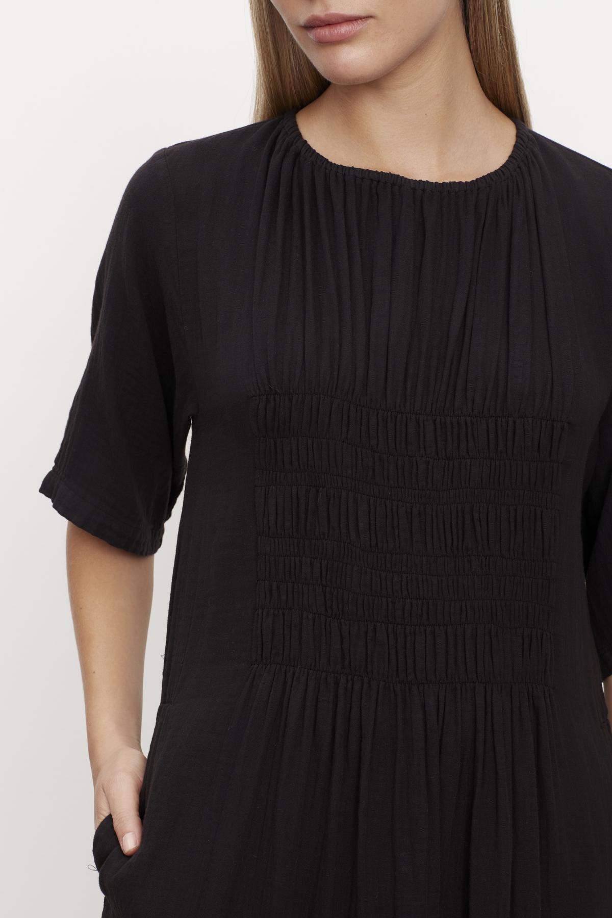 A woman wearing the ASHLEIGH COTTON GAUZE MAXI DRESS by Velvet by Graham & Spencer.