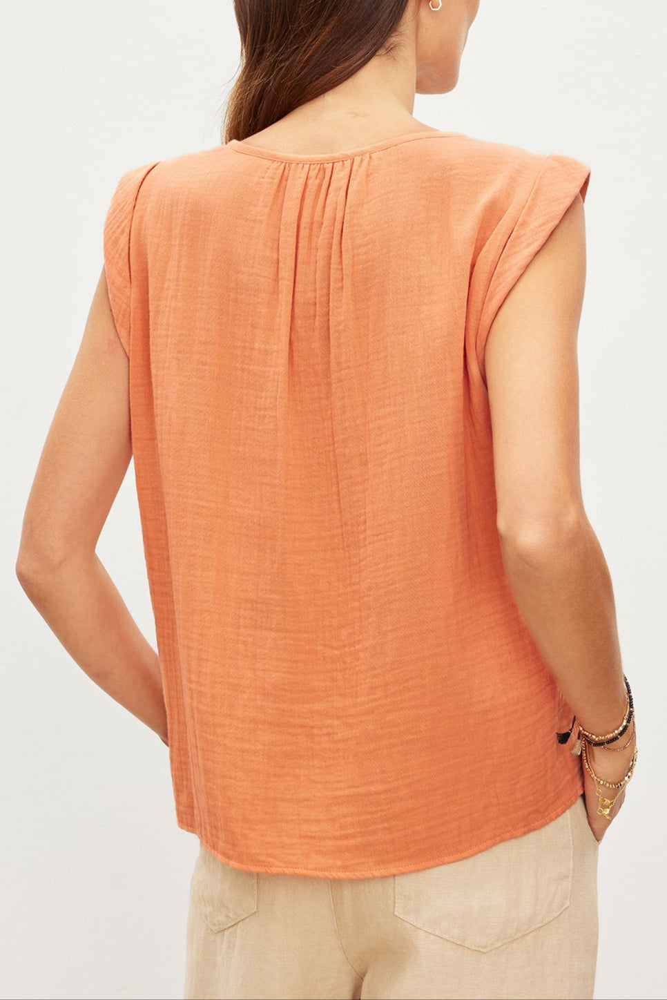 A woman, seen from behind, dons a JAYLA COTTON GAUZE TANK TOP made by Velvet by Graham & Spencer.-35967557599425