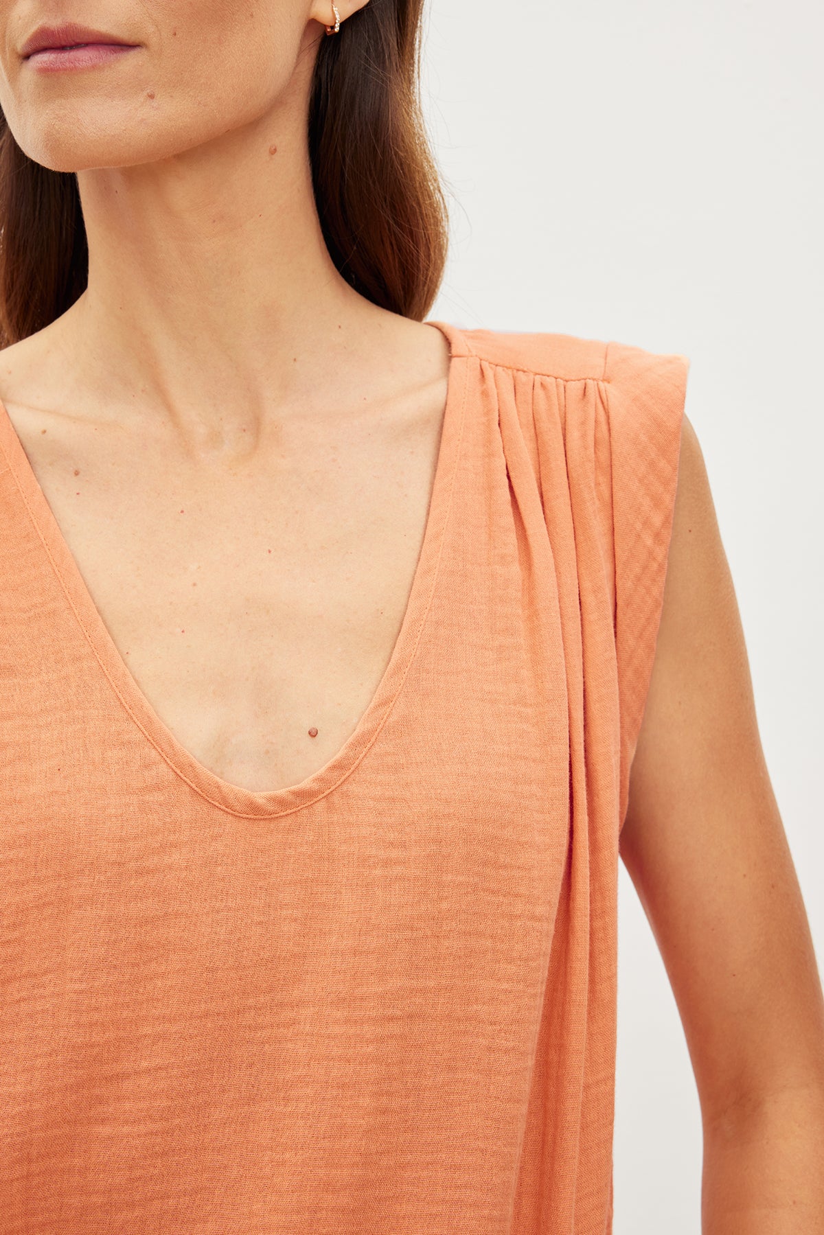 A close up of a woman's Velvet by Graham & Spencer JAYLA COTTON GAUZE TANK TOP.