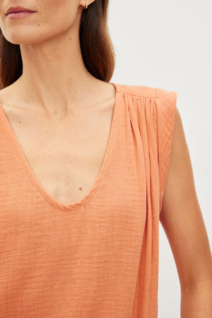 A close up of a woman's Velvet by Graham & Spencer JAYLA COTTON GAUZE TANK TOP.