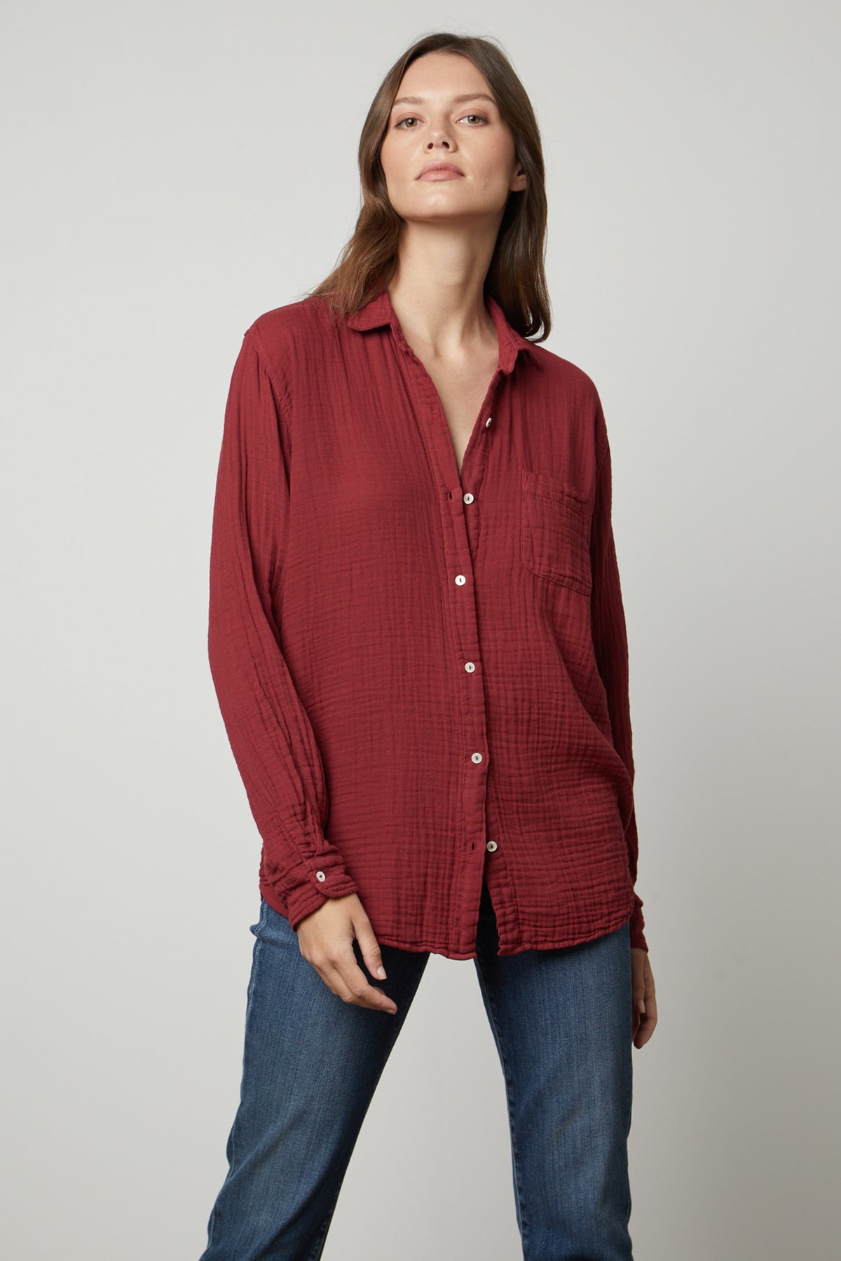 The model is wearing a Velvet by Graham & Spencer MARGO COTTON GAUZE BUTTON-UP SHIRT.-35655940473025