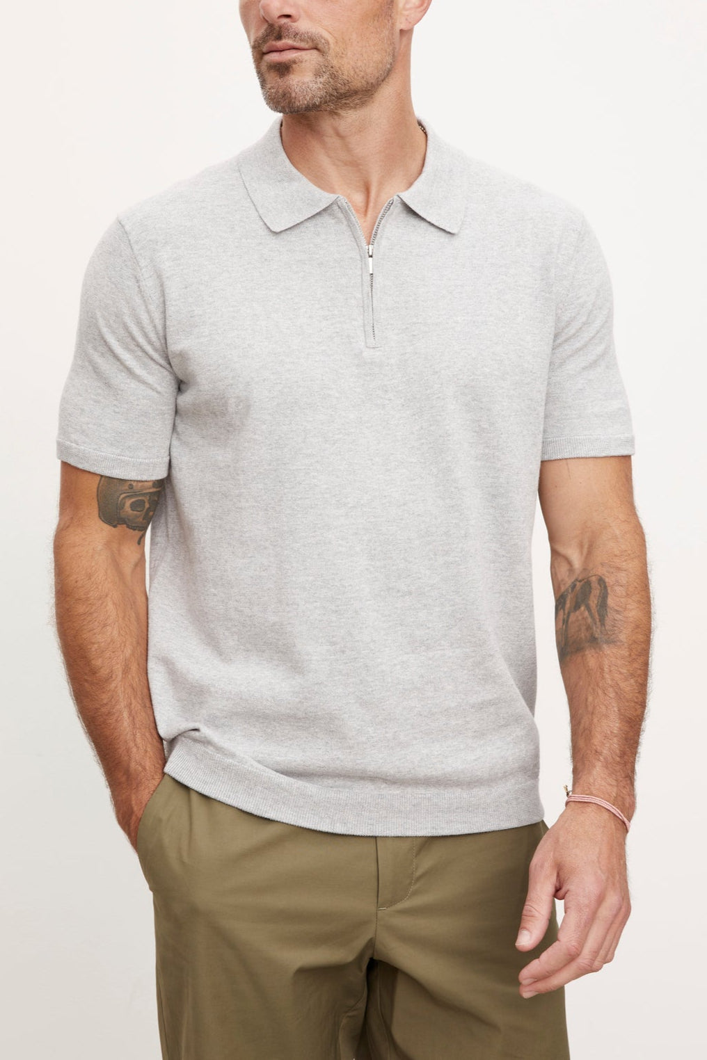 A man wearing the Velvet by Graham & Spencer OTTO ZIP POLO shirt.-36009964273857