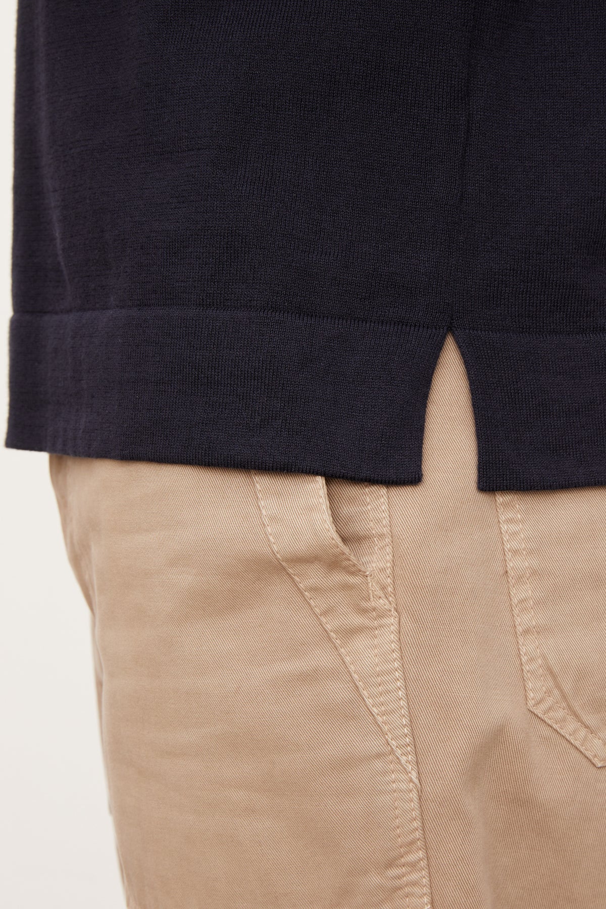   A man wearing a Velvet by Graham & Spencer tan RICO POLO shirt and khaki pants. 