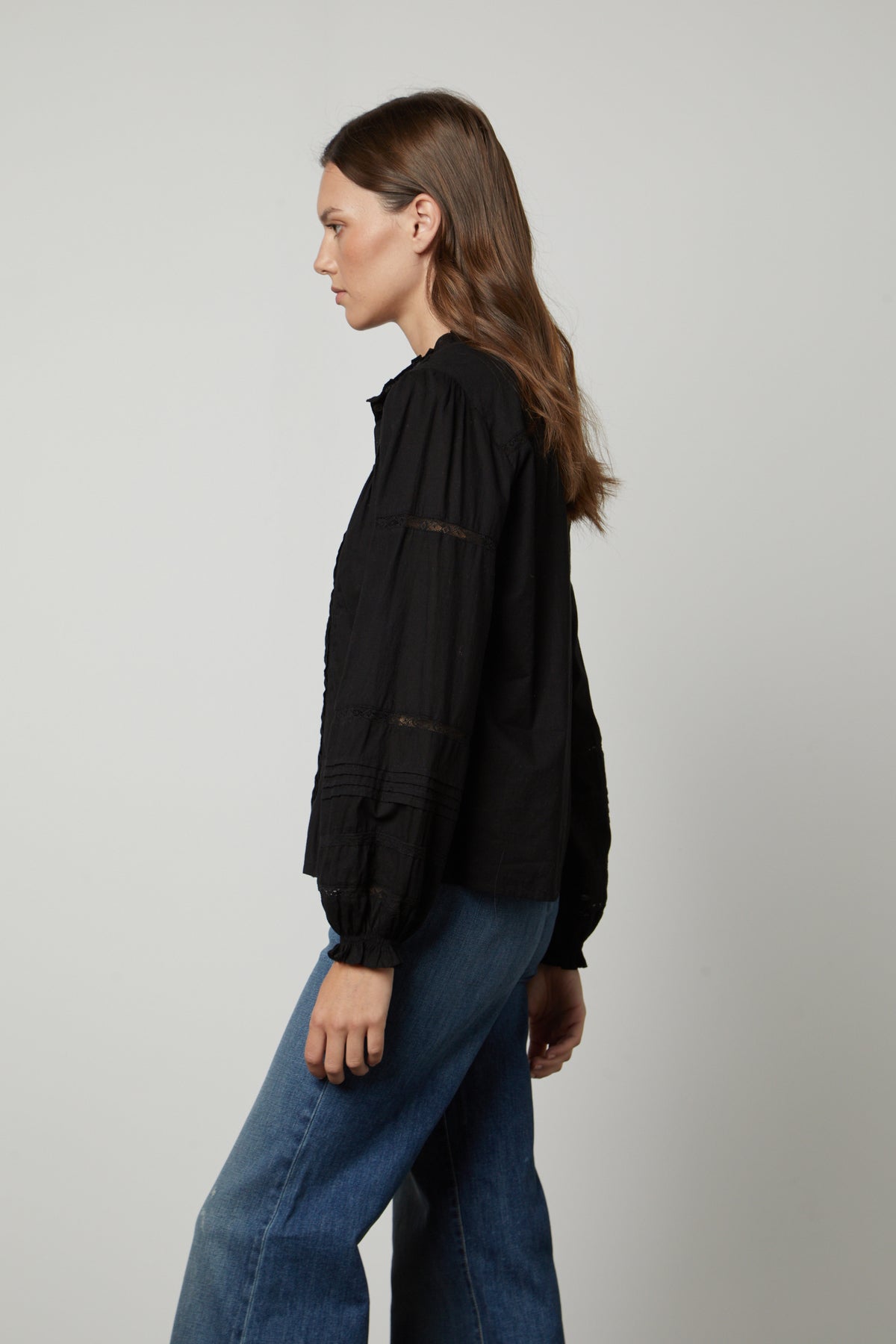 The model is wearing the ROMY LACE BOHO TOP by Velvet by Graham & Spencer.