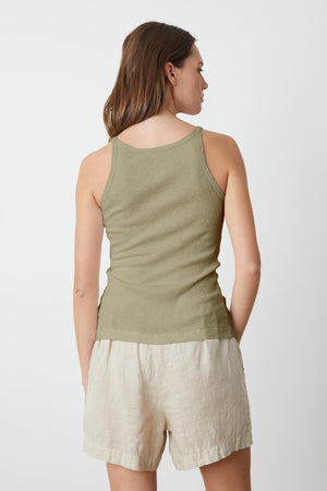 the back view of a woman wearing a Velvet by Graham & Spencer ALIZA RIBBED COTTON LAYERING TANK and shorts.