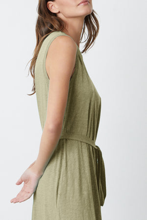 a woman wearing the Velvet by Graham & Spencer EDITH SLEEVELESS MAXI DRESS in olive green.