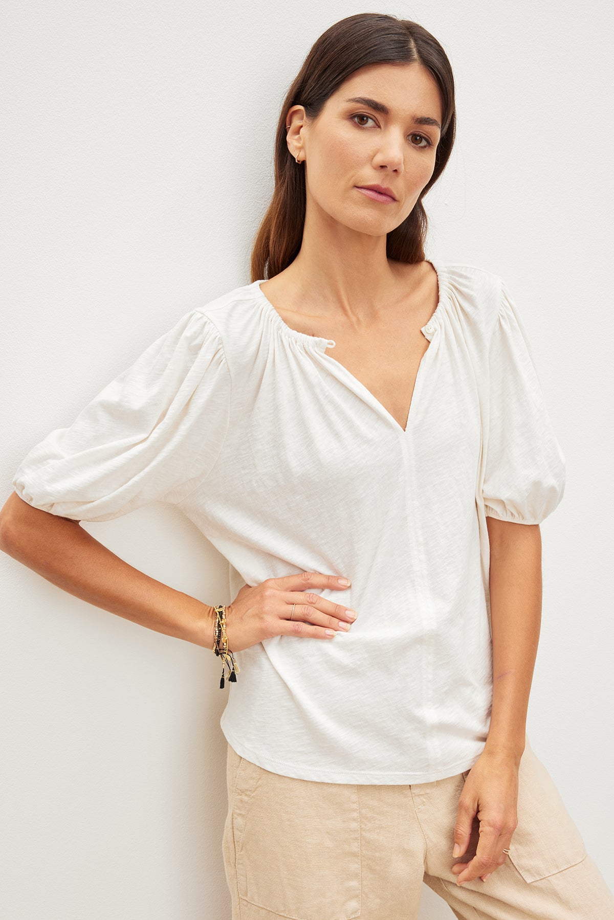 The model is wearing a Velvet by Graham & Spencer LEE RELAXED TEE.-35967724912833