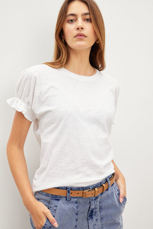A woman wearing a MIMI CREW NECK TEE, a wardrobe essential made of cotton slub fabric by Velvet by Graham & Spencer.