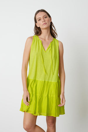 A PAIGE TIERED DRESS by Velvet by Graham & Spencer is being worn by a model.