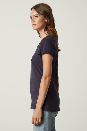 the back view of a woman wearing ODELIA COTTON SLUB CREW NECK TEE by Velvet by Graham & Spencer jeans and a t - shirt.