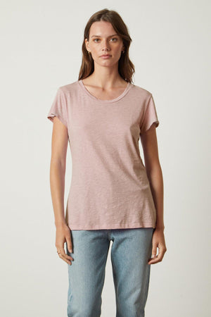 A woman wearing a Velvet by Graham & Spencer ODELIA COTTON SLUB CREW NECK TEE and jeans.