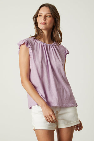 Stacy tank in lavender thistle tucked into white denim shorts front