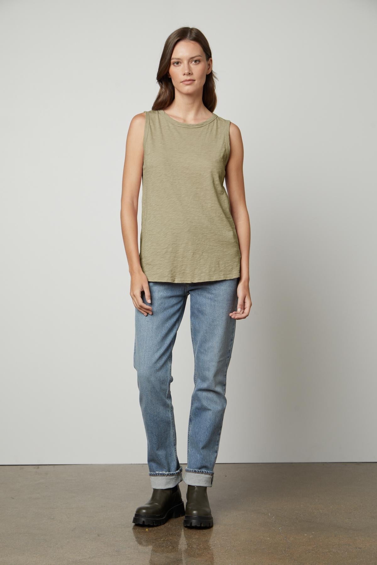 a woman wearing jeans and a Velvet by Graham & Spencer TAURUS COTTON SLUB TANK.