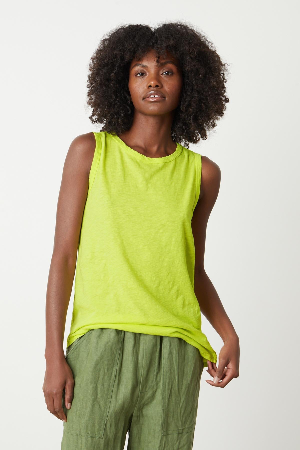 A woman wearing a Velvet by Graham & Spencer TAURUS COTTON SLUB TANK in bright citrus front with Cindy pants front