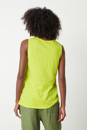 A woman wearing a bright citrus TAURUS COTTON SLUB TANK by Velvet by Graham & Spencer back