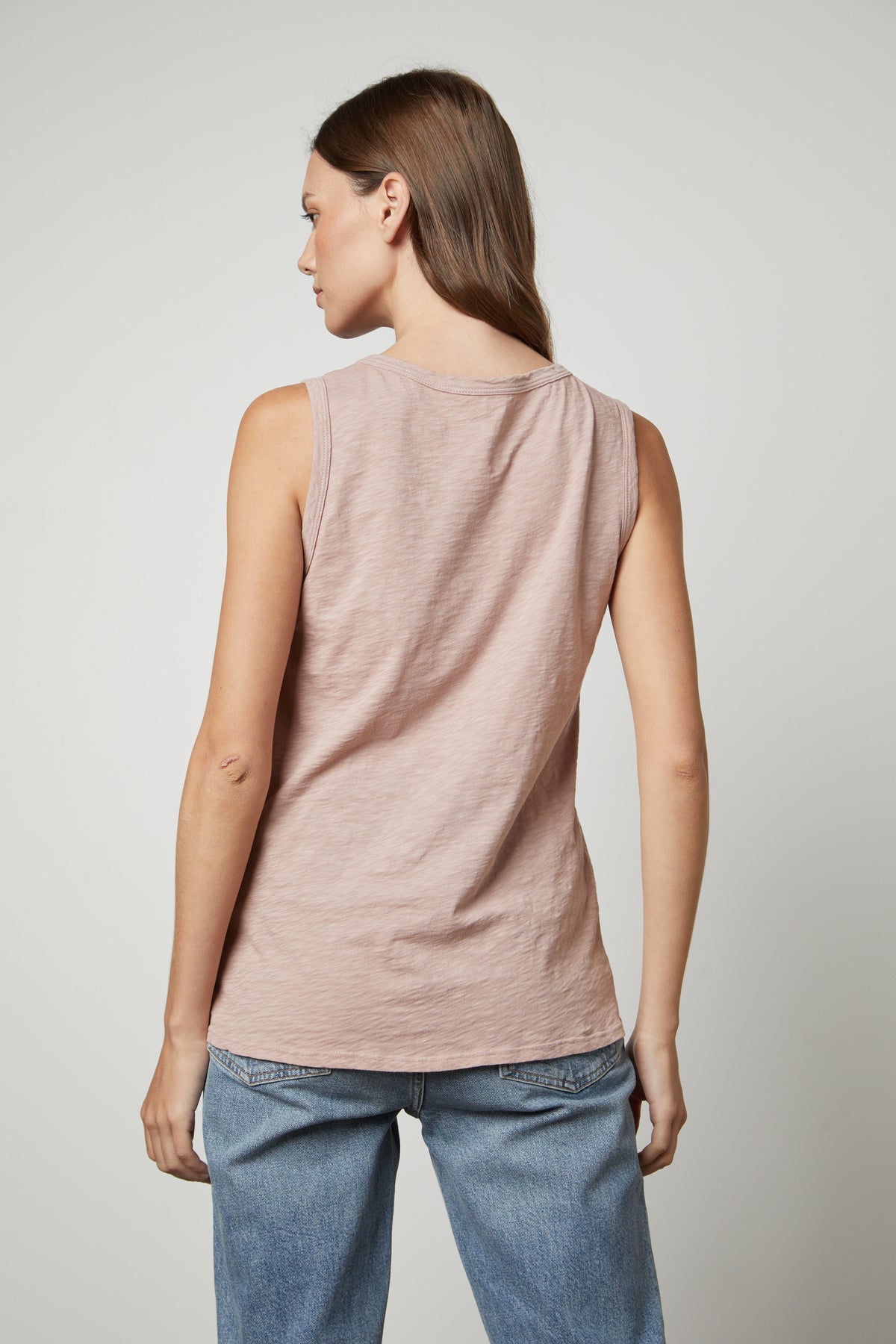 The back view of a woman wearing a TAURUS COTTON SLUB TANK by Velvet by Graham & Spencer.